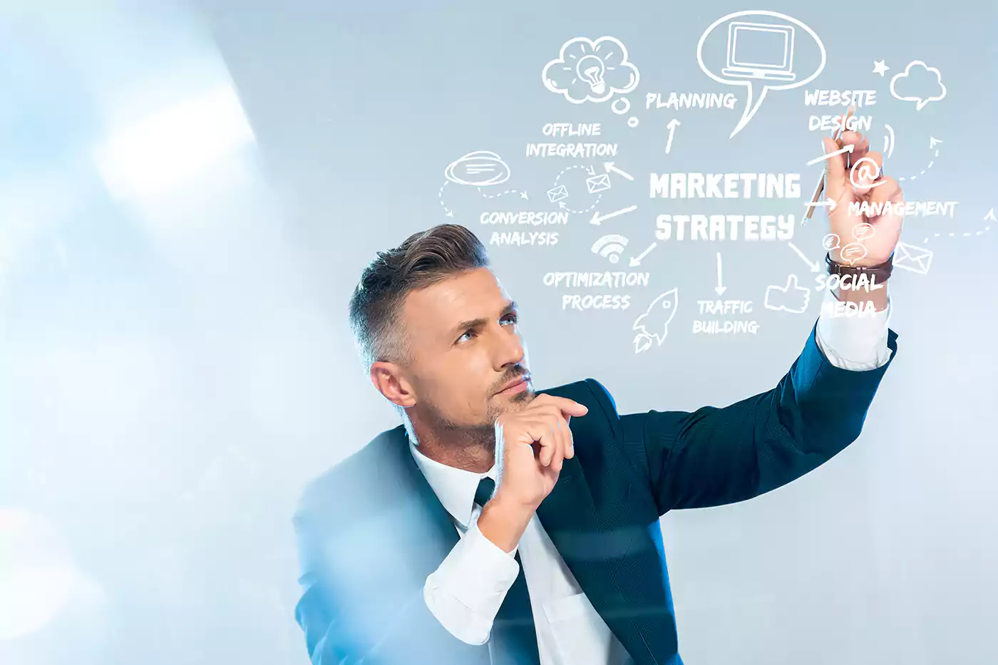 businessman drawing marketing strategy